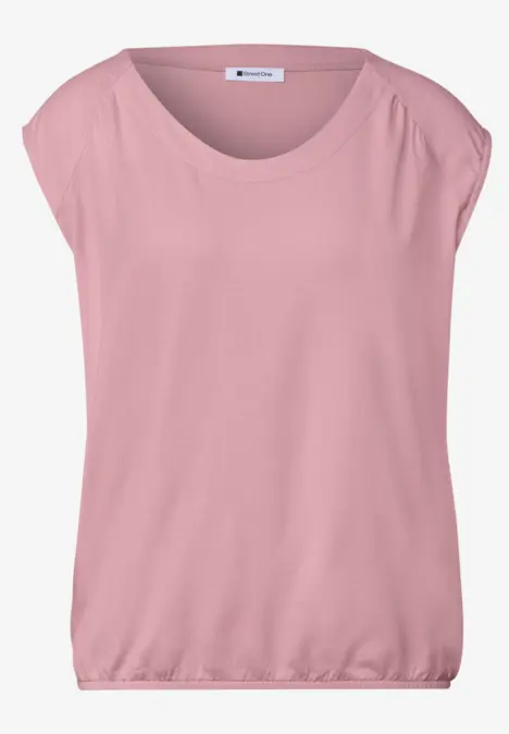Locker geschnittenes, rosafarbenes Kurzarmshirt mit weitem Rundhalsausschnitt und elastischem Bund.