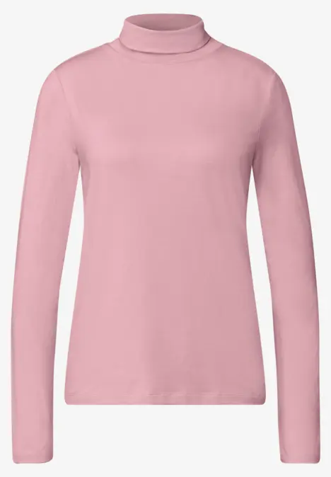 Pull col roulé rose à manches longues, design épuré.