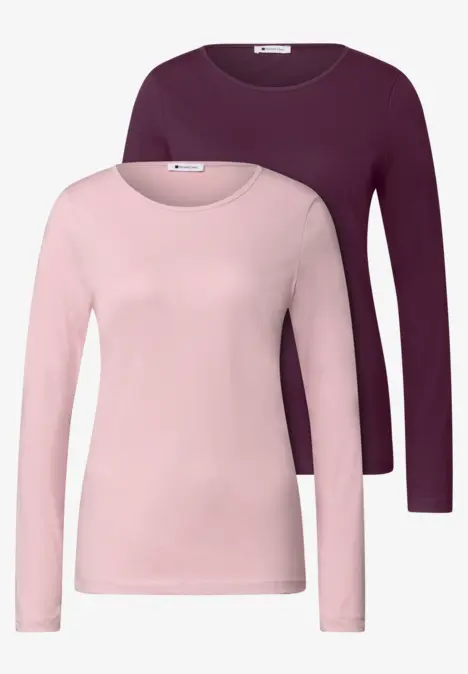 Deux hauts à manches longues pour femmes en rose clair et violet foncé.