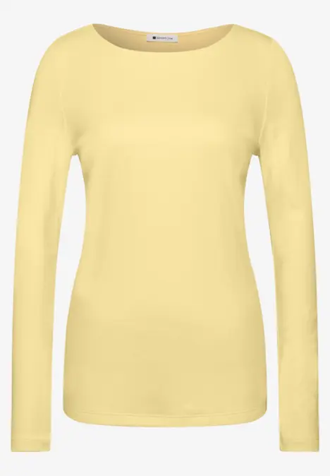 T-shirt à manches longues simple de couleur jaune pâle pour femme.