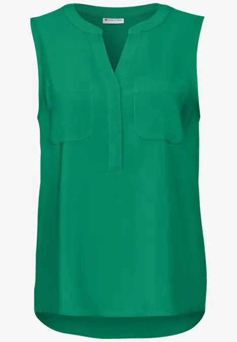 Grüne ärmellose Bluse mit V-Ausschnitt und zwei Brusttaschen.