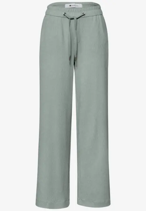 Grüne, lässige Sweatpants mit weitem Bein und Kordelzugbund.