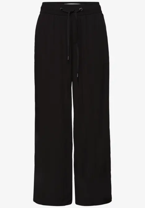 Pantalon ample noir à cordon de serrage, coupe décontractée pour un style casual.