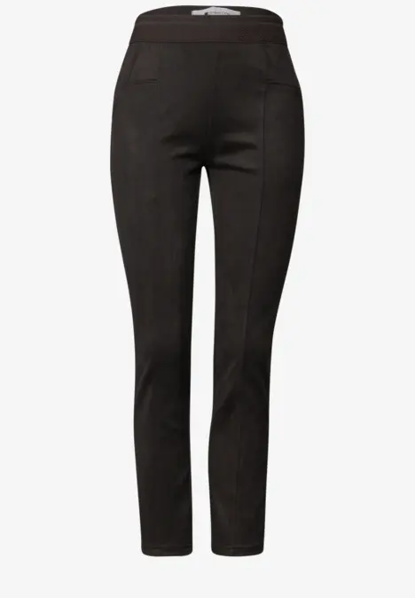 Pantalon noir femme taille haute, coupe slim et jambes effilées.