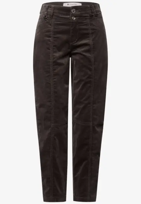 Pantalon en velours côtelé noir, taille haute, coupe fuselée et coutures apparentes.