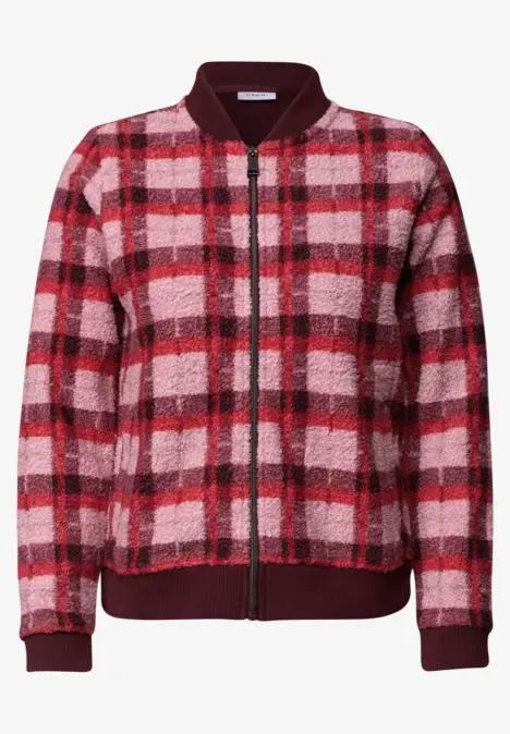 Blouson bomber polaire rouge et rose à carreaux, fermeture éclair et bord-côtes.