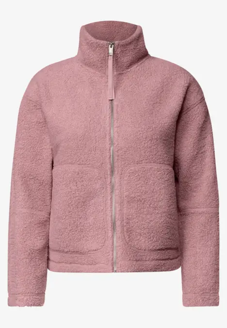 Veste polaire rose avec col montant et fermeture éclair, douce et chaude.