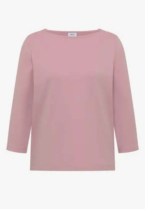 T-shirt à manches longues rose poudré pour femme, col bateau et coupe droite.