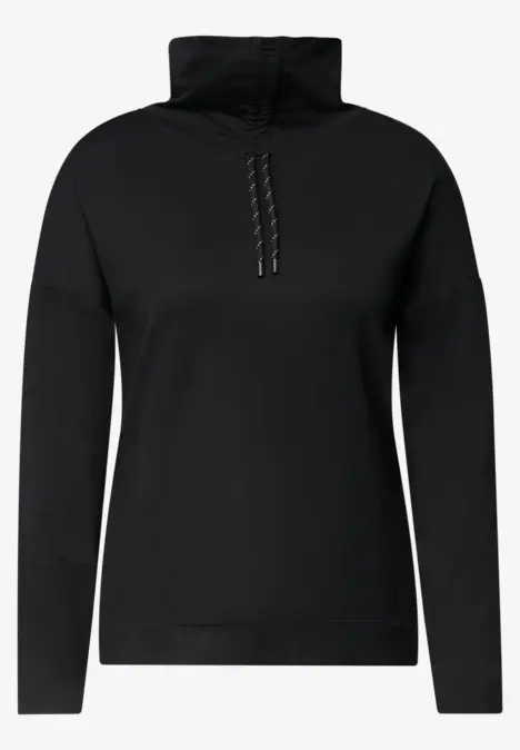 Pull noir pour femme, col montant et demi-zip, style épuré.