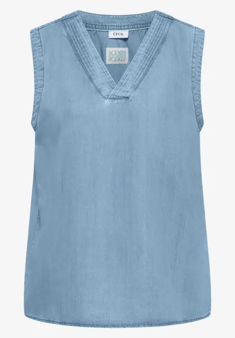 Haut sans manches en jean bleu clair avec décolleté en V.