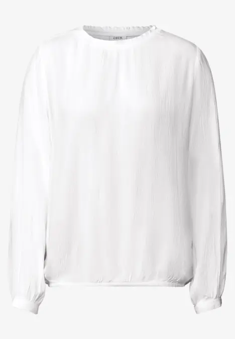 Weiße, langärmlige Bluse mit lockerem Schnitt.