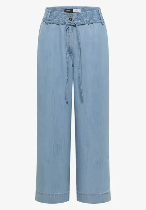 Pantalon jean ample bleu clair taille haute, cordon de serrage et jambe droite.