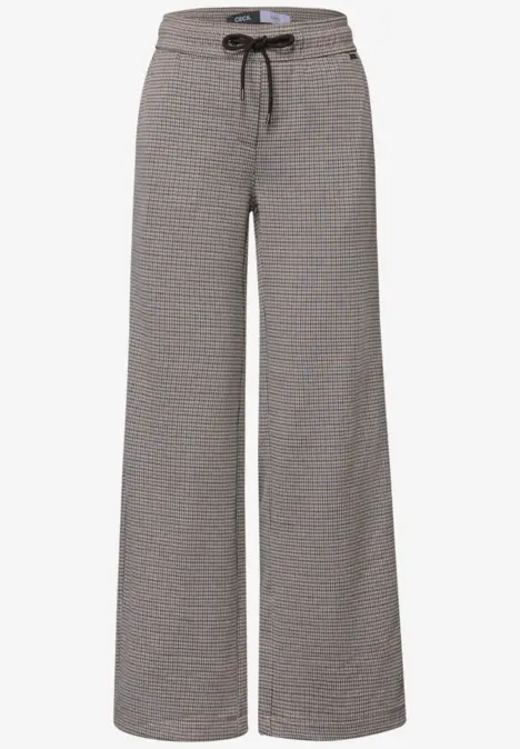 Pantalon lounge gris à jambe large, motif discret et cordon de serrage à la taille.