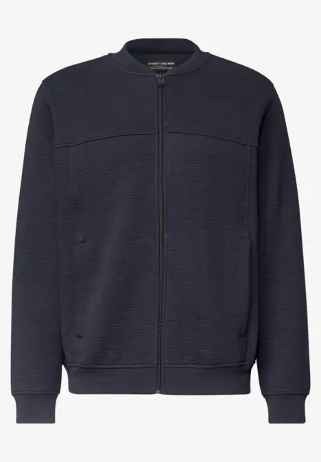 Blouson bomber bleu marine à fermeture éclair, poches latérales et finitions côtelées.