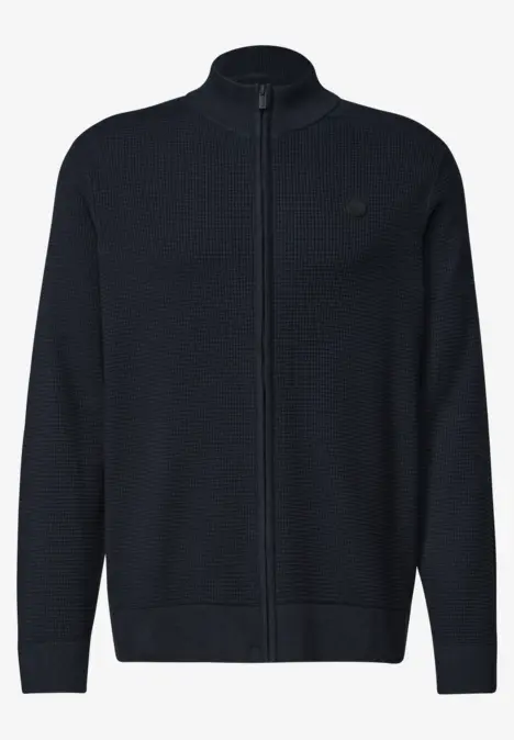 Cardigan en maille bleu marine, zip intégral, col montant, bas et poignets côtelés, petit logo poitrine.