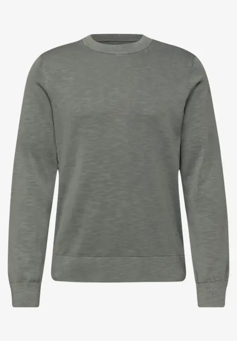 Un sweat gris uni à col rond, manches longues et poignets côtelés.