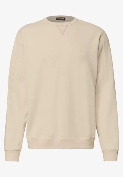 Sweat-shirt beige uni à col rond avec poignets et ourlet côtelés.
