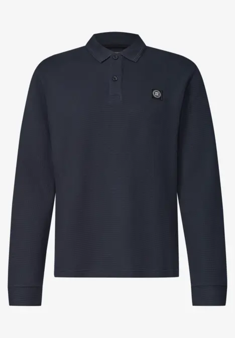 Polo à manches longues bleu foncé avec patte de boutonnage et petit logo.