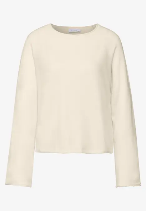Schlichter, cremefarbener Pullover mit langen Ärmeln.