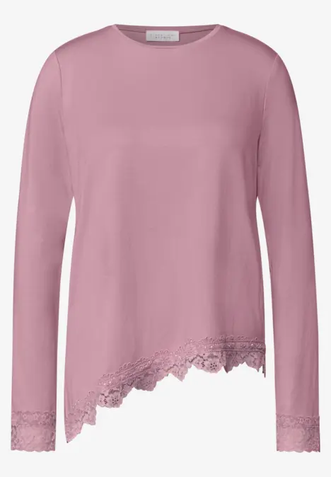 T-shirt rose à manches longues avec dentelle asymétrique au bas