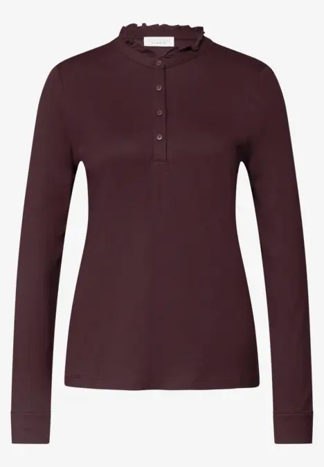 Dames top bordeaux met lange mouwen, opstaande kraag en knoopsluiting.