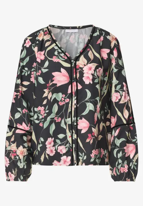 Blouse noire zippée à motif floral rose, col en V et poignets élastiqués, manches longues