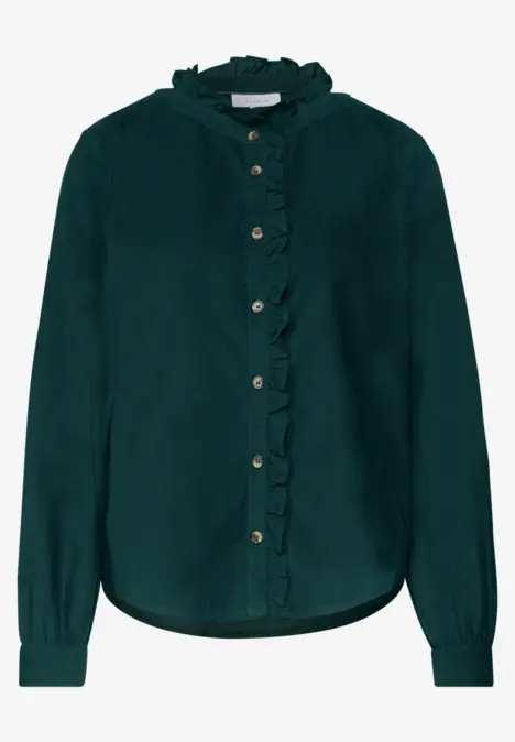 Chemisier vert foncé pour femme avec volants, manches longues et boutons.