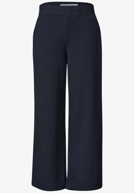 Weite, dunkelblaue Hose aus rippenstrukturiertem Stoff mit hohem Bund.