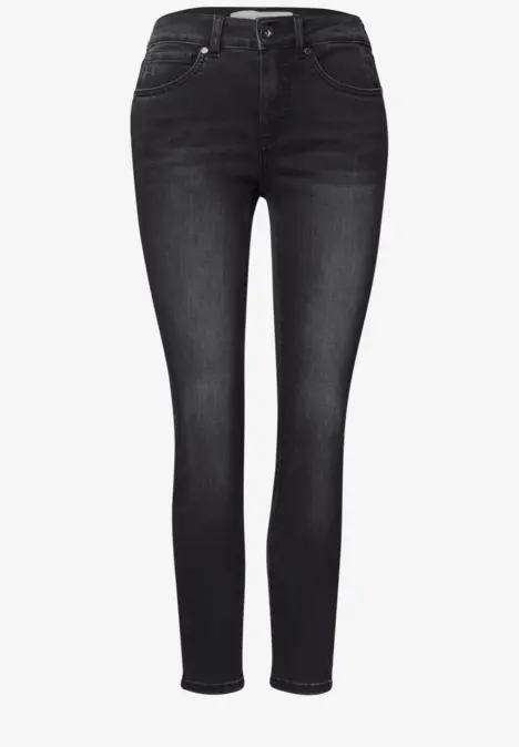 Jean skinny femme noir, taille haute et coupe ajustée de la taille jusqu'aux chevilles.