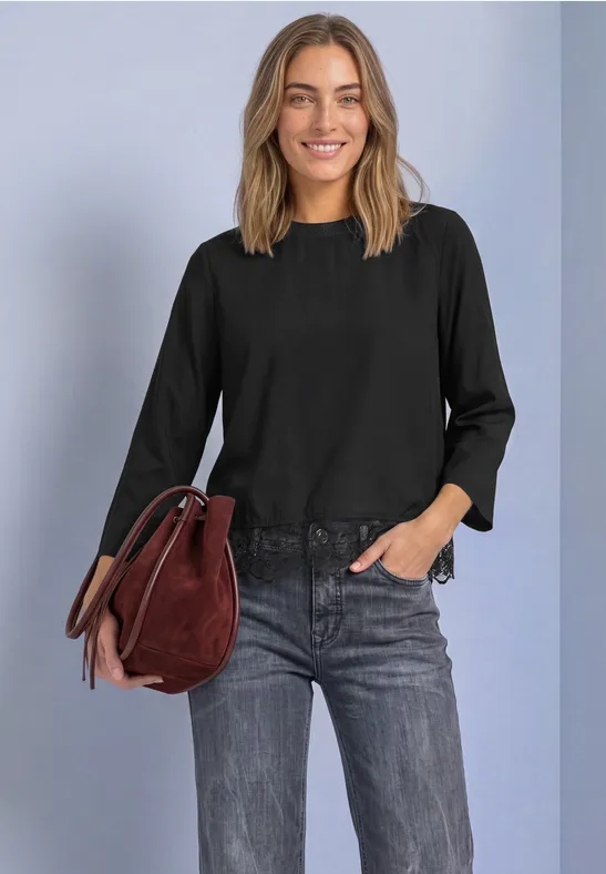 Blouse met ronde hals en kanten rand